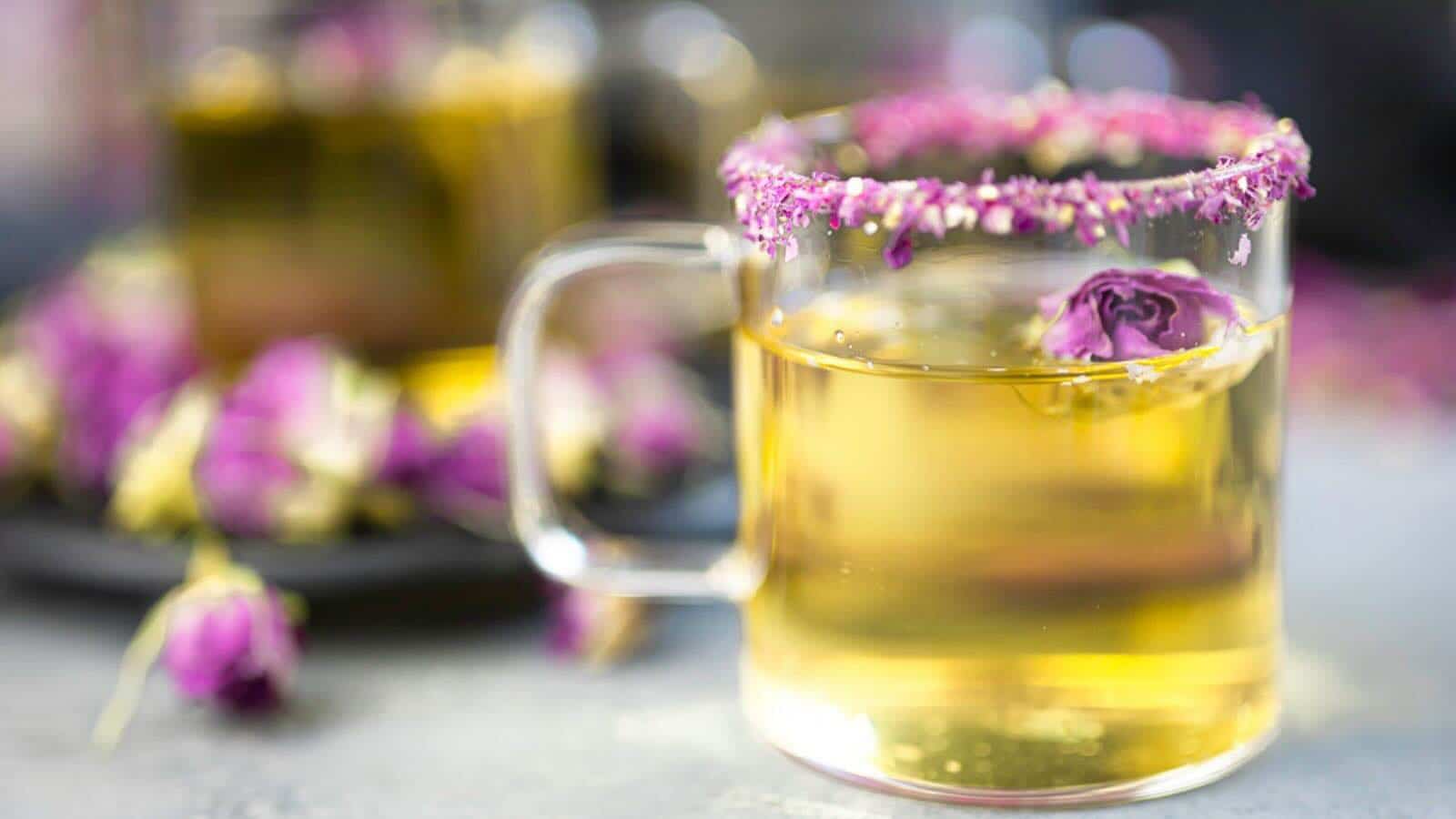 Rose petal tea in a cu with rose bud.
