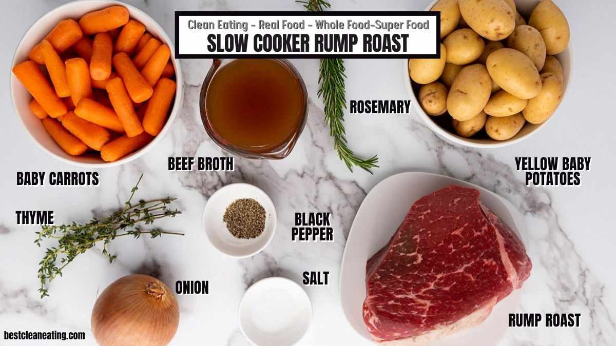 Top-down view of ingredients for slow cooker rump roast, including raw rump roast, baby carrots, yellow potatoes, onion, thyme, rosemary, beef broth, salt, and black pepper.