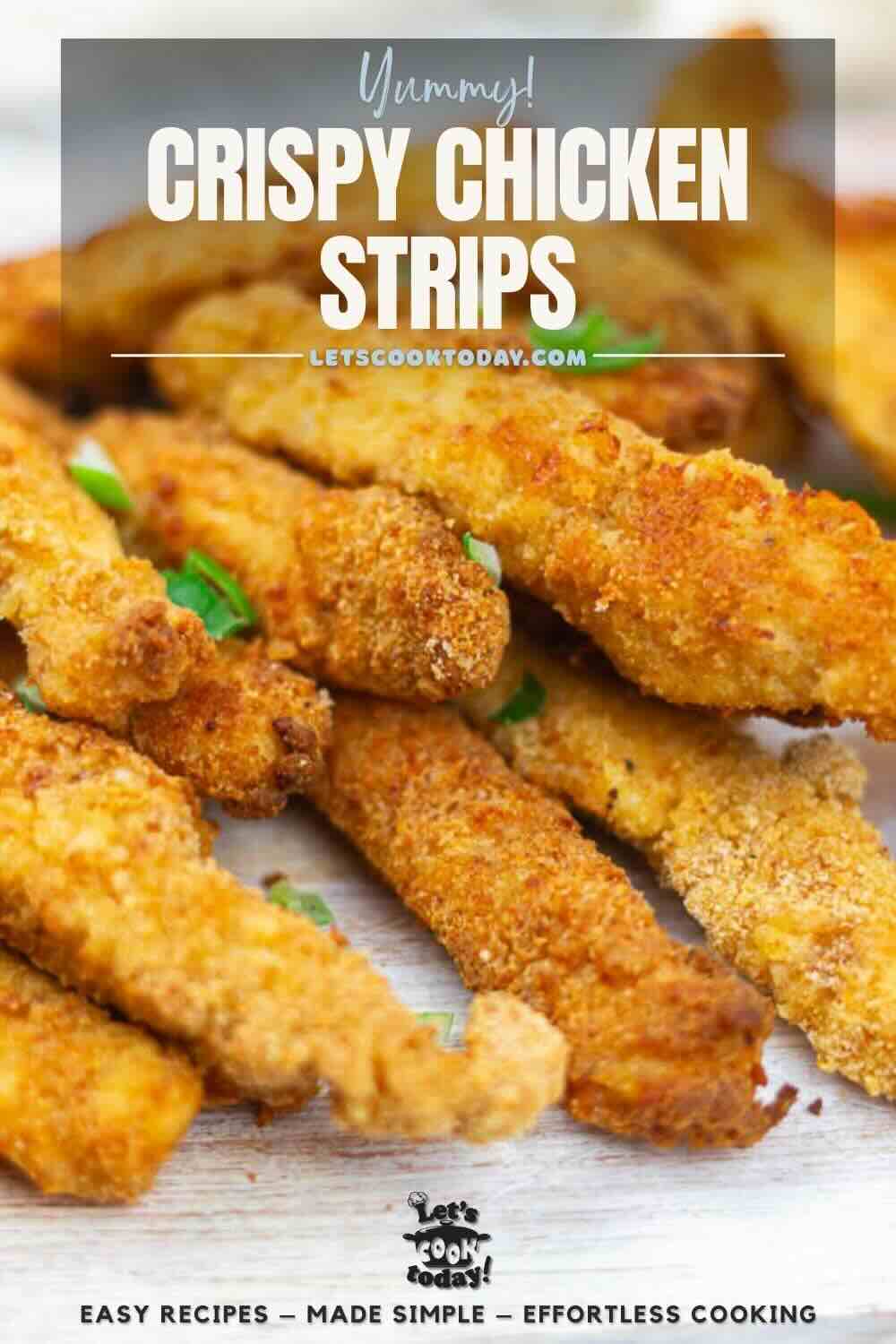 Golden crispy chicken strips stacked on wooden board.