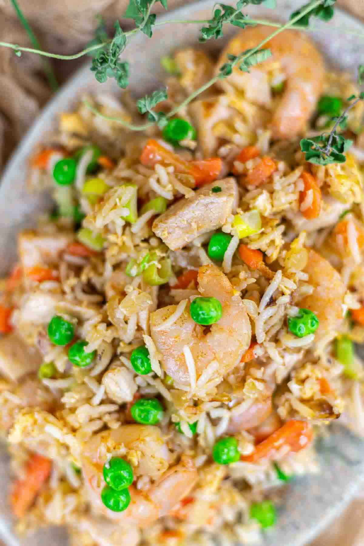 Shrimp and chicken fried rice with peas.