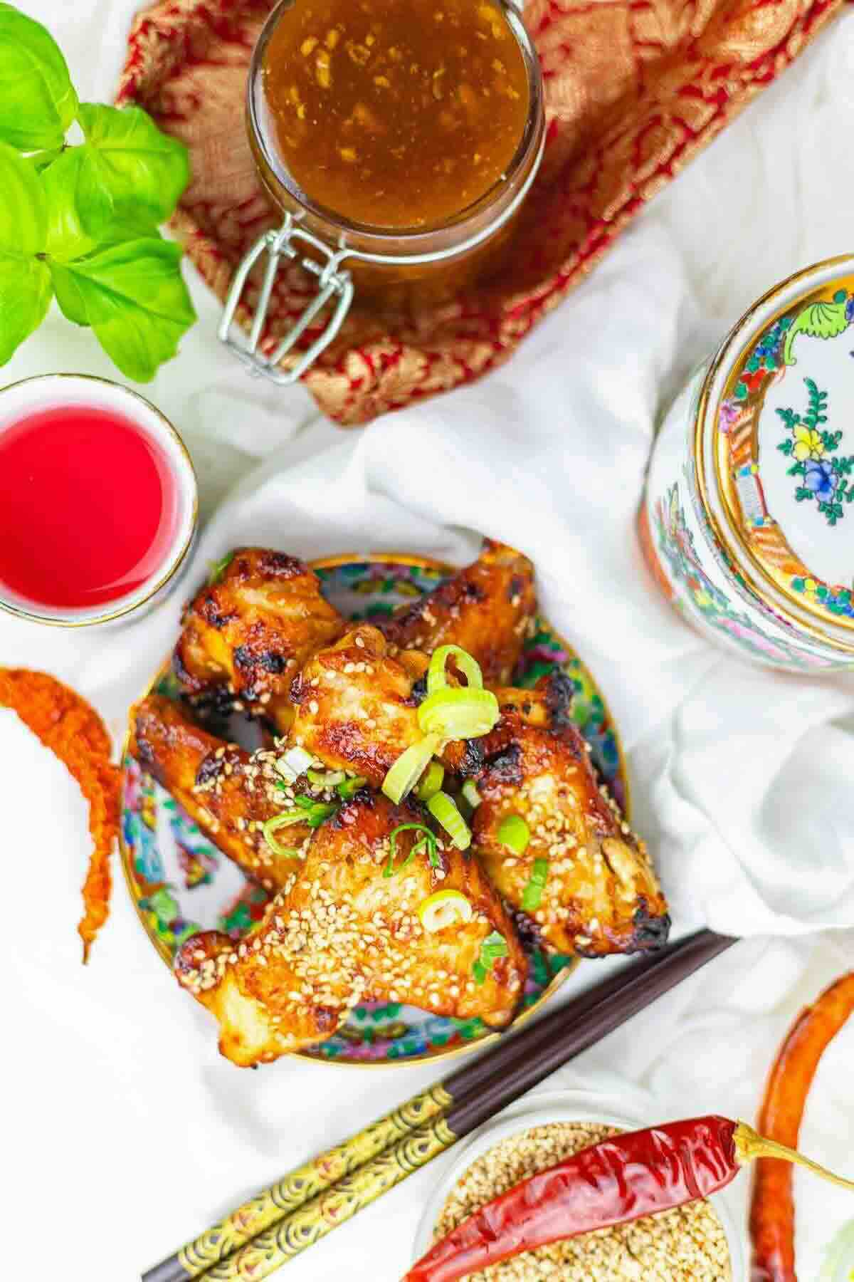 Overhead view of BBQ wings with sauce.