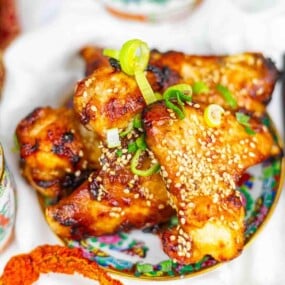 Crispy wings topped with sesame and scallions.