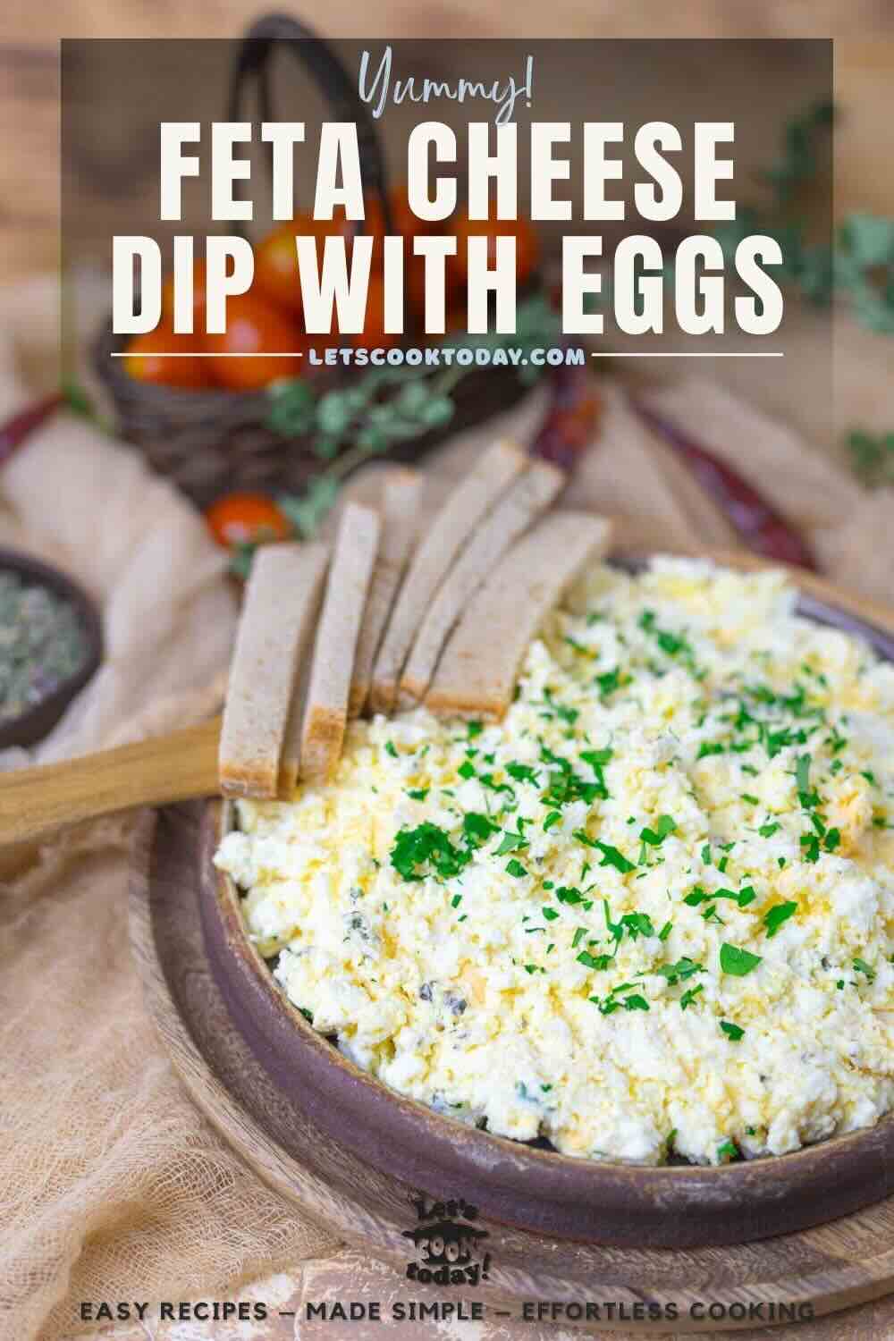 A plate of feta cheese mixed with eggs, topped with chopped parsley, and served with slices of bread on the side. Text overlay reads "Feta Cheese Dip with Eggs.