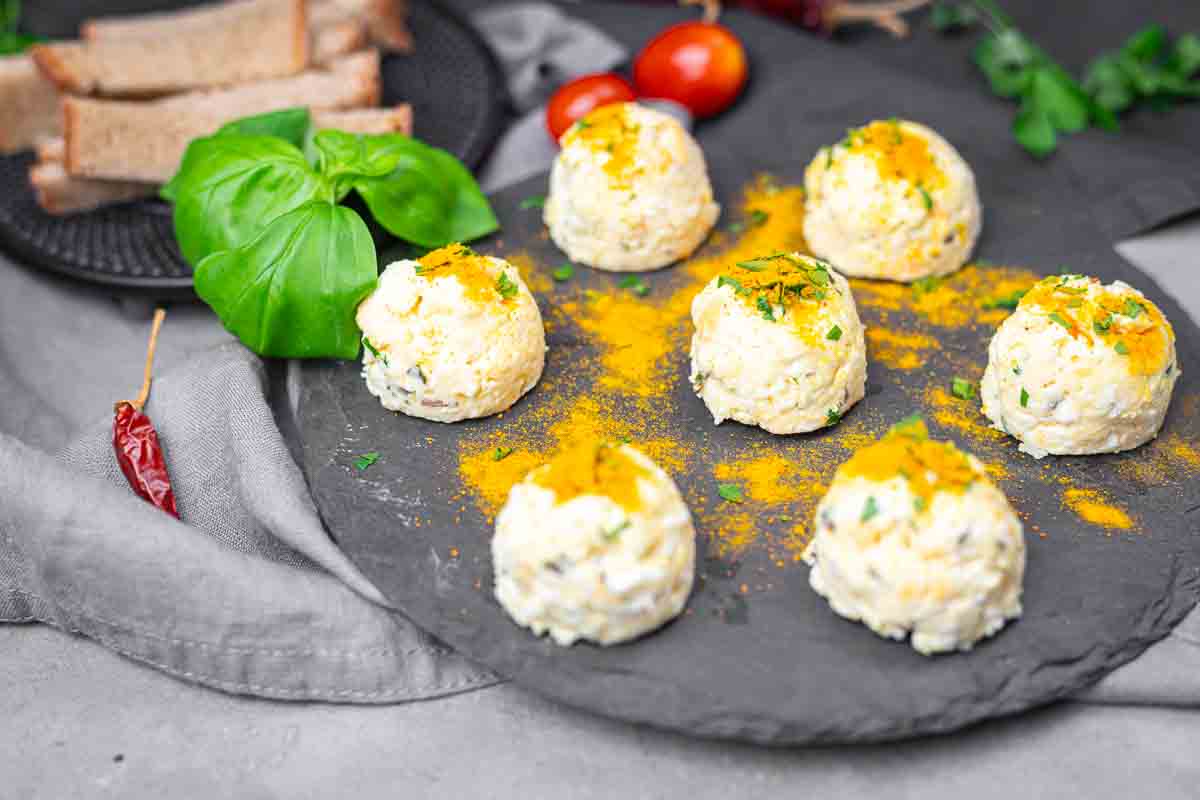 Feta egg bites topped with fresh herbs.