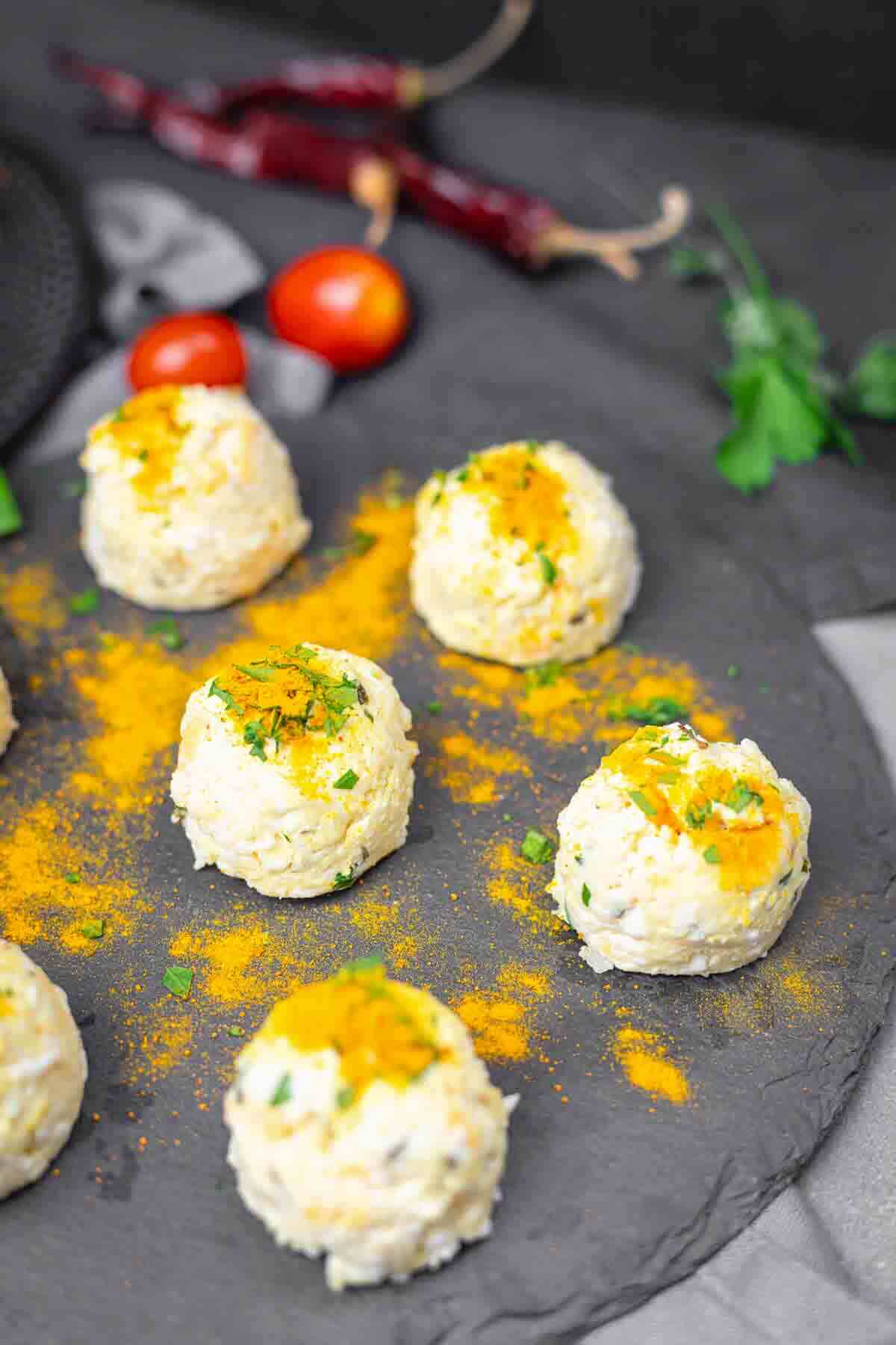 Close up of golden baked feta bites.
