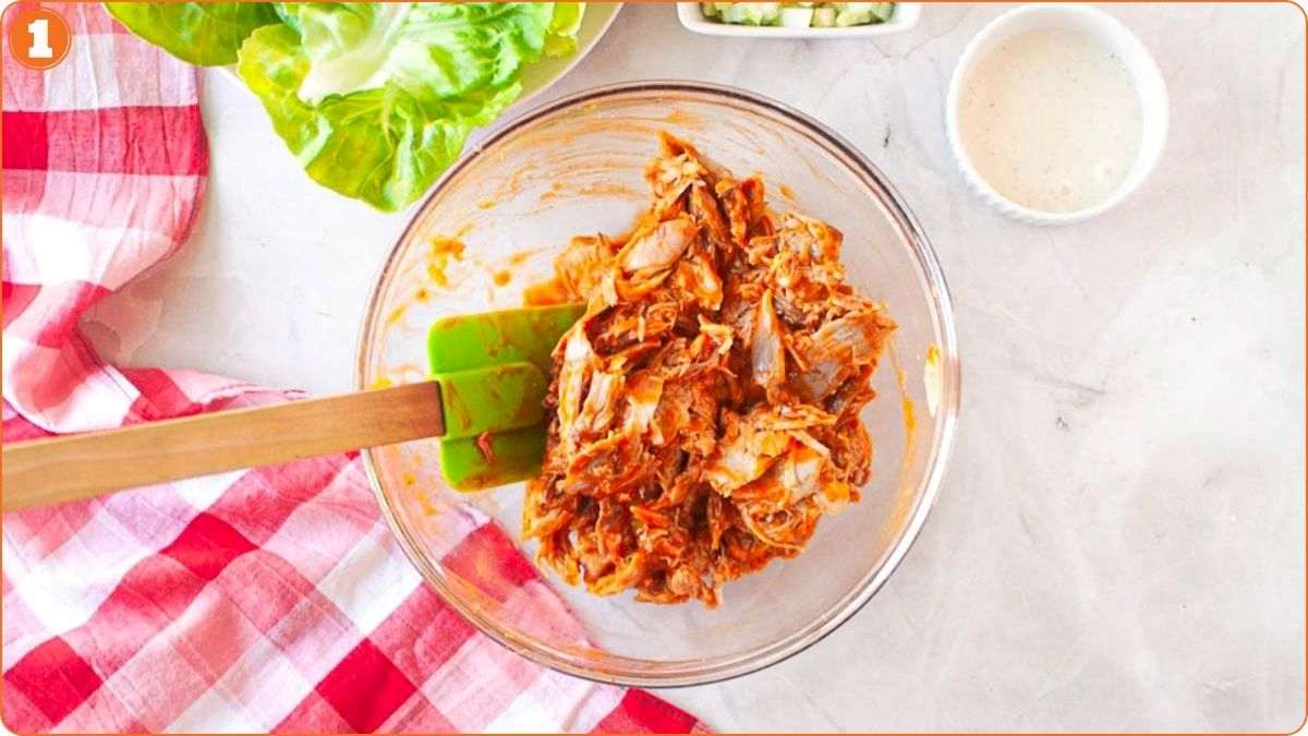 Shredded chicken mixed with buffalo sauce.