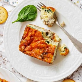 Cheesy sausage egg strata with spinach slice.