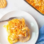 Slice of yellow squash casserole served on plate.