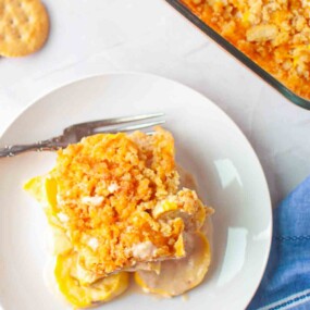 Slice of yellow squash casserole served on plate.