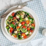 Summer salad with cucumbers tomatoes olives and feta.