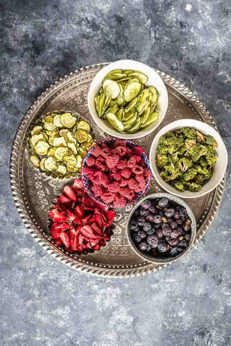 Colorful dried fruit and vegetable assortment displayed.