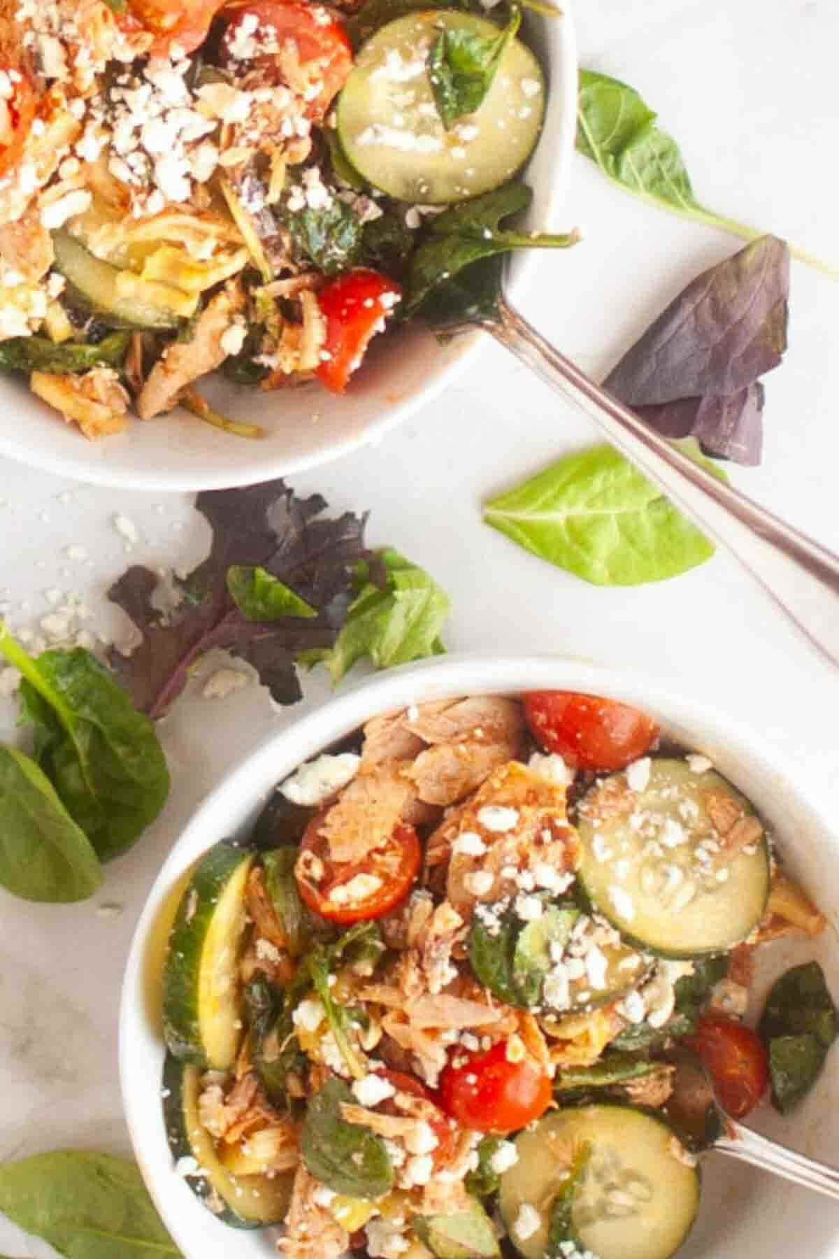 Buffalo chicken salad with greens and cheese.