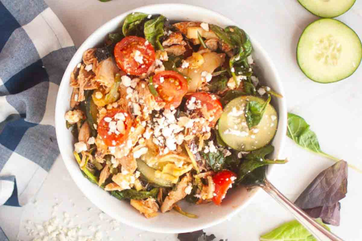 Fresh buffalo chicken salad topped with feta.
