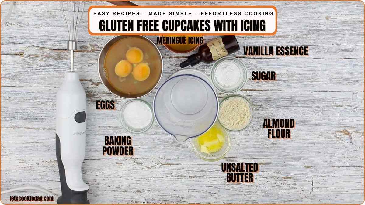 Top-down view of ingredients for gluten-free cupcakes with icing, including eggs, baking powder, meringue icing, vanilla essence, sugar, almond flour, and unsalted butter.