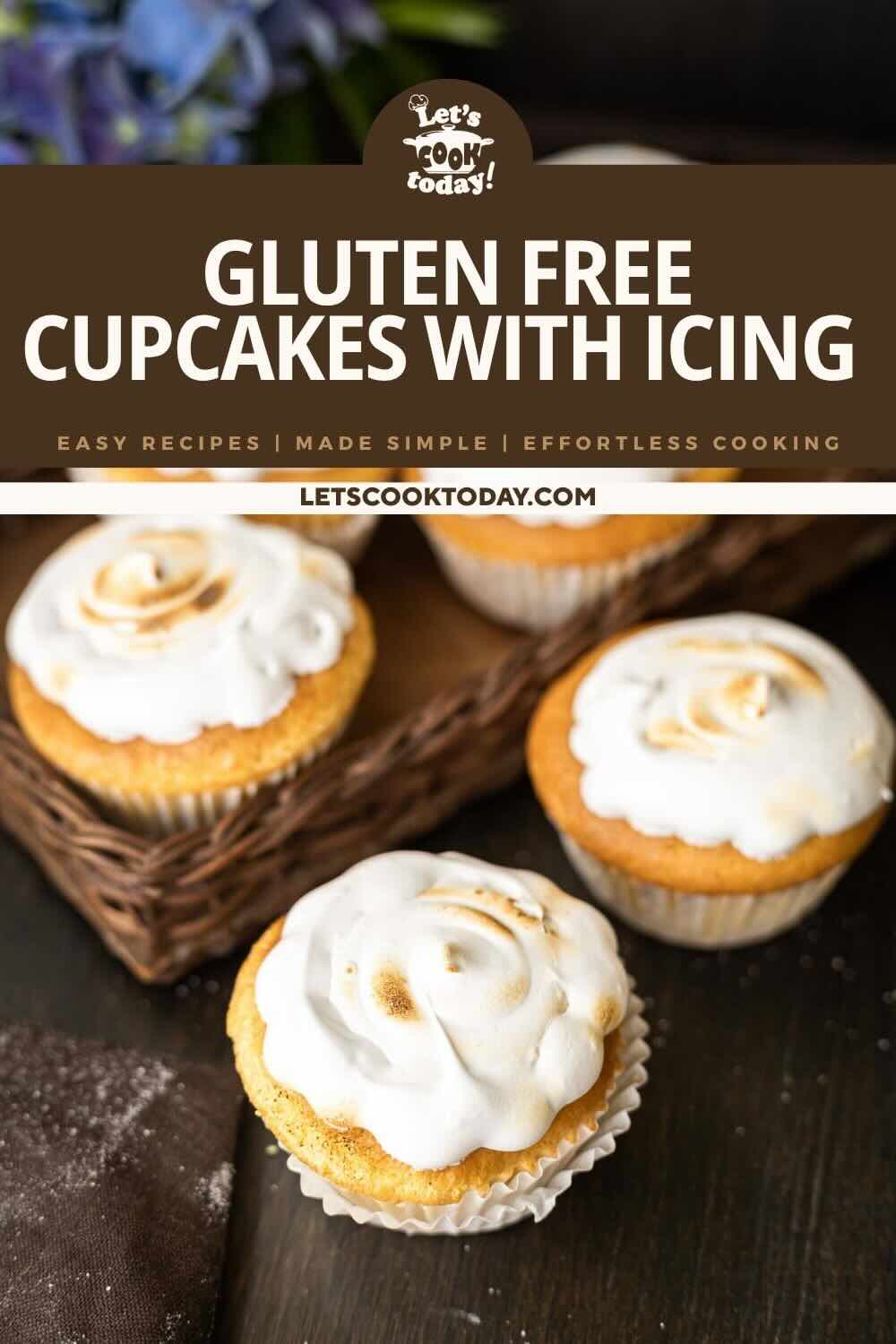 Four gluten-free cupcakes with white icing are displayed on a table, with three in a wicker basket and one in the foreground.