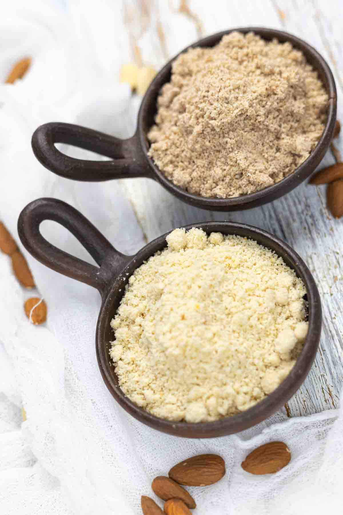Almond flour and ground almonds on table.