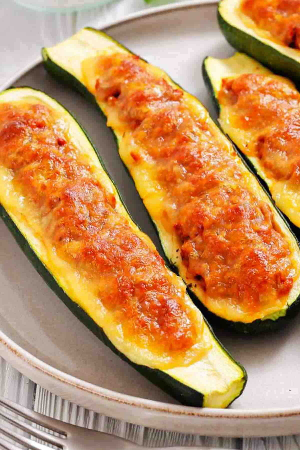 Golden baked zucchini stuffed with meat filling.
