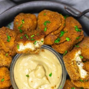 Close-up of crispy ground chicken nuggets served.