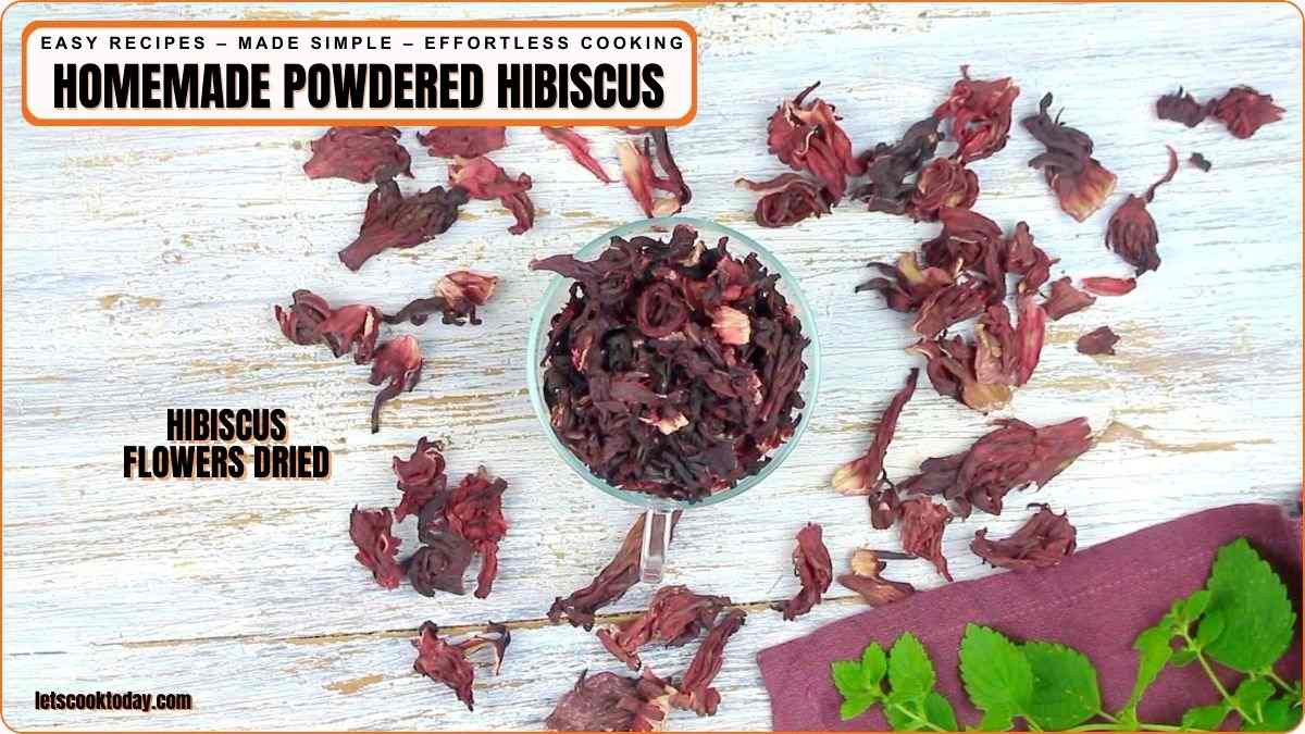 Dried hibiscus flowers arranged on white table.