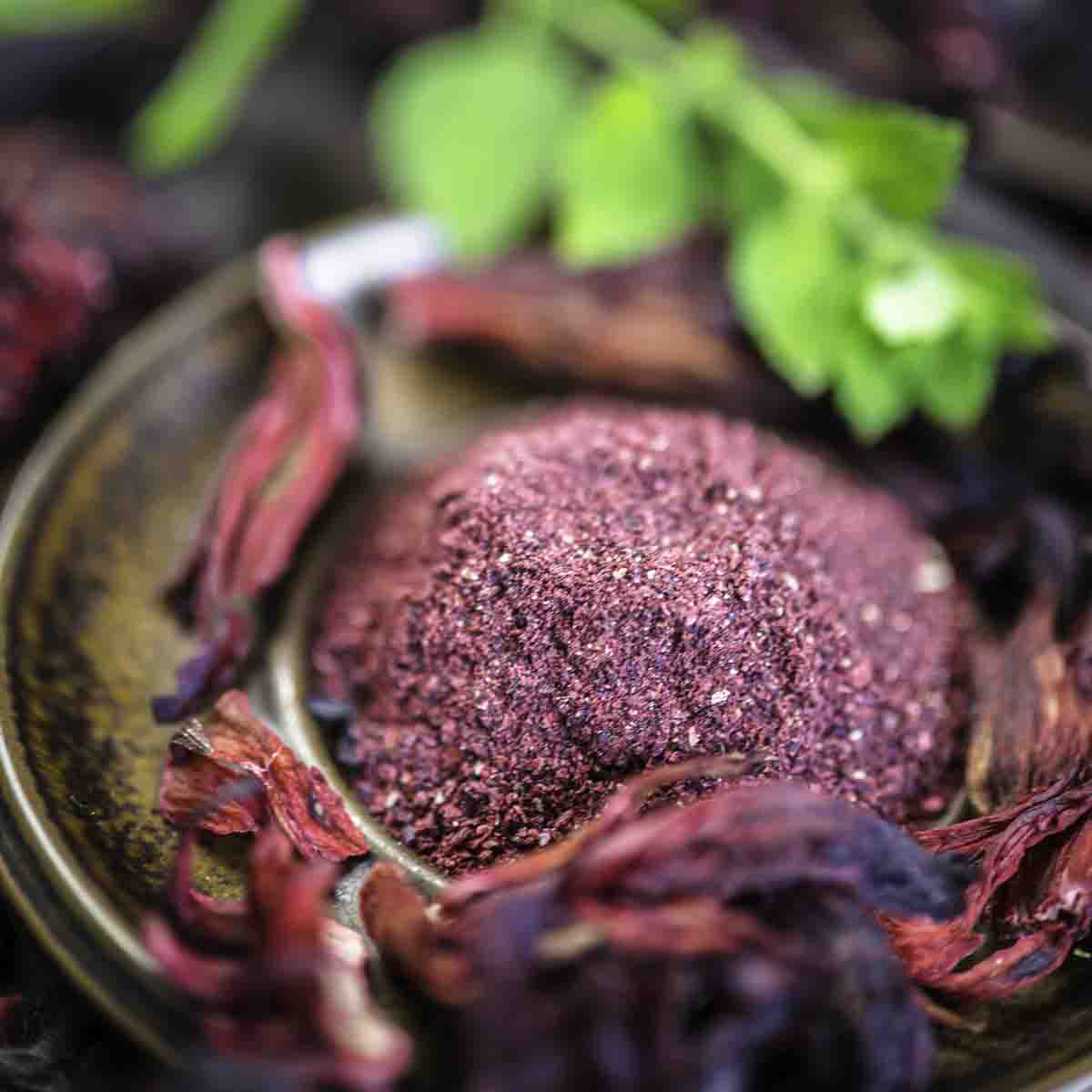 Close-up of hibiscus powder with leaves.