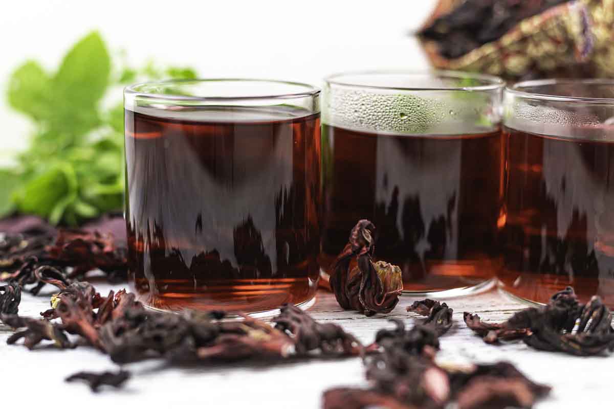 Close-up of steaming sorrel tea in glasses.