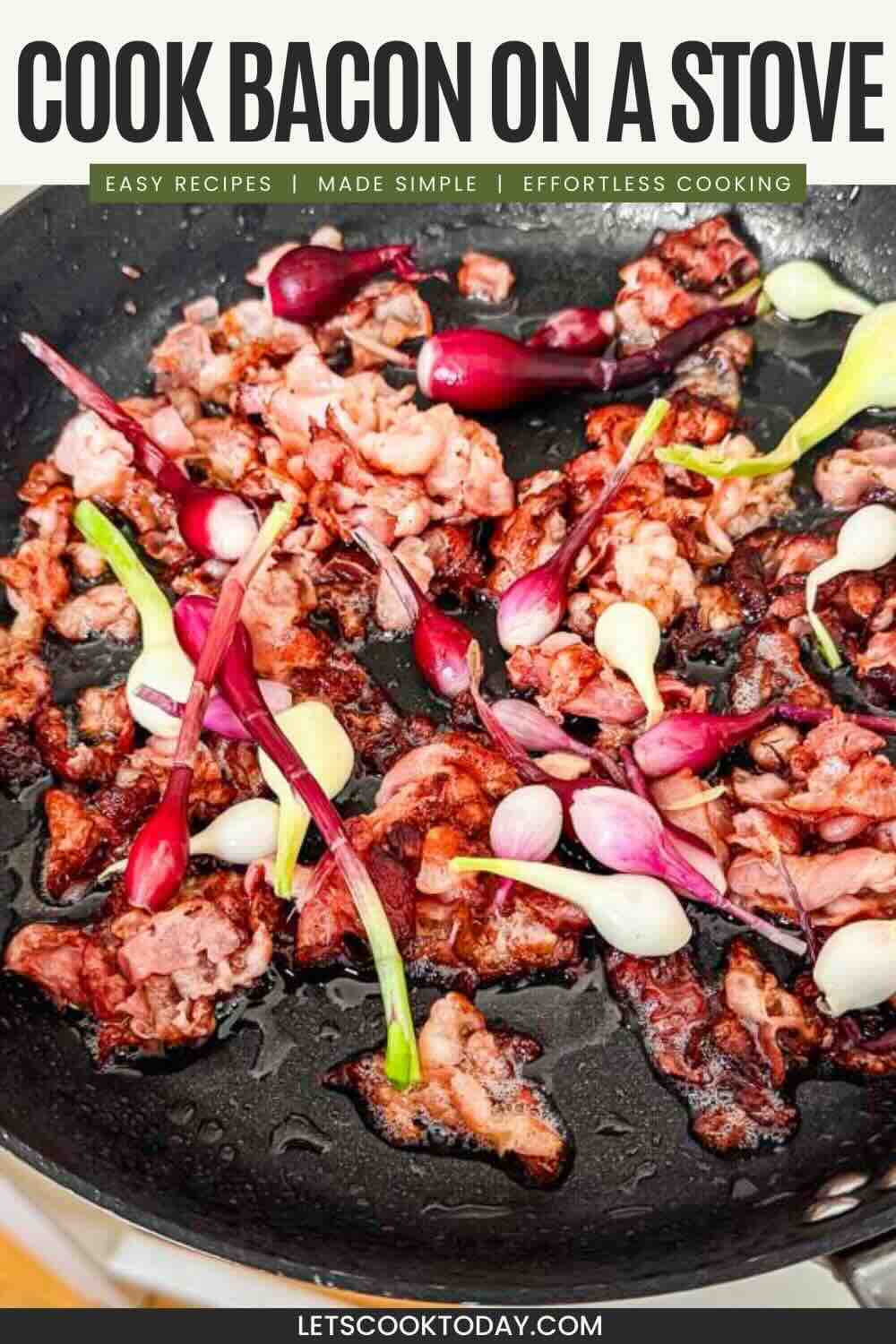 Bacon slices and whole green onions cooking in a black skillet on a stovetop.