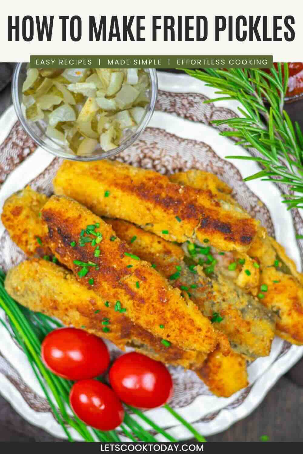 A plate of breaded and fried pickle spears garnished with chopped chives, served with cherry tomatoes, rosemary, and a small bowl of diced pickles.