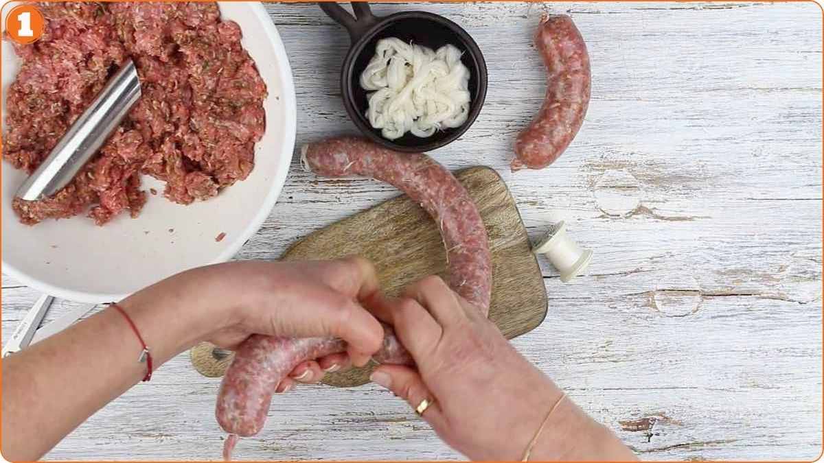 Twisting sausage links to form separate pieces.