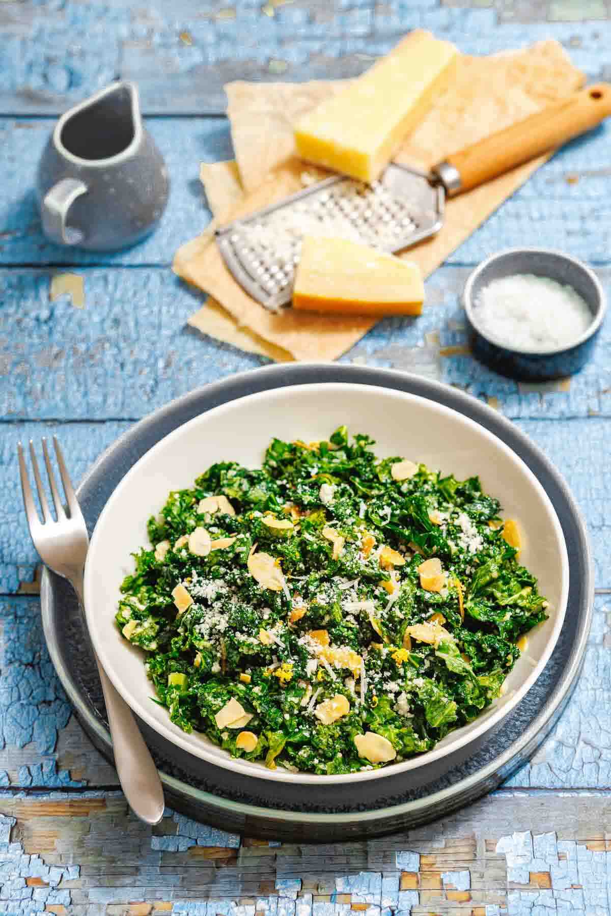 Kale salad with shaved almonds and cheese.