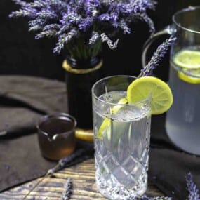 Refreshing lavender mocktail with lemon garnish.