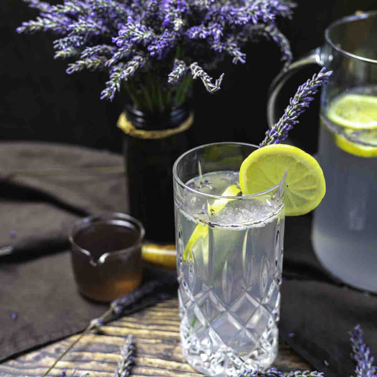 Refreshing lavender mocktail with lemon garnish.