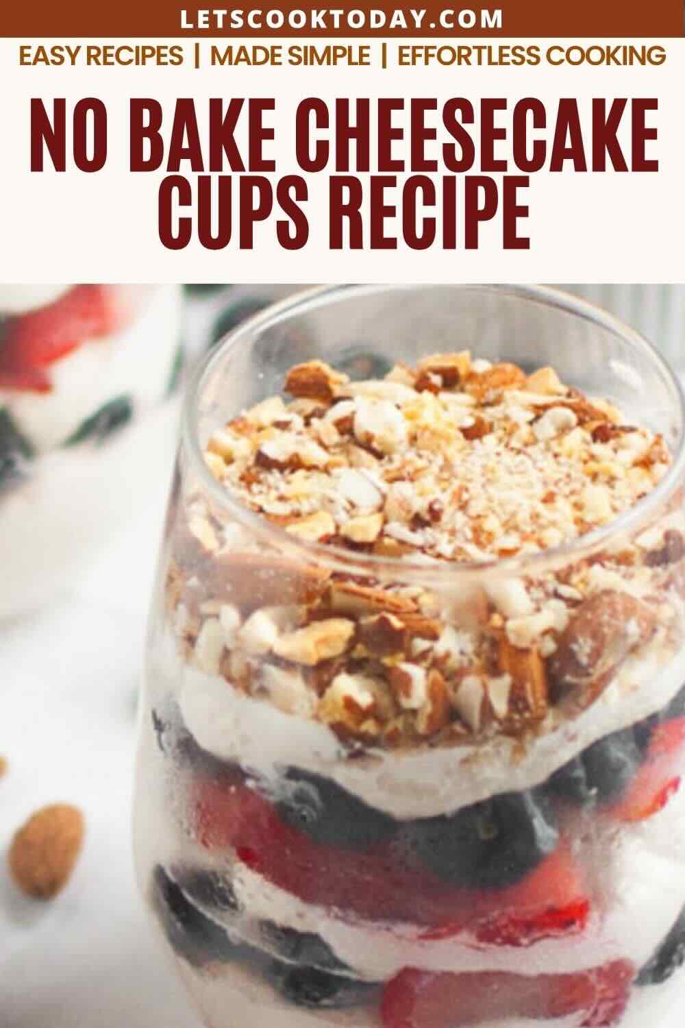 A glass cup filled with layers of cheesecake, berries, and granola, with text above reading "No Bake Cheesecake Cups Recipe.