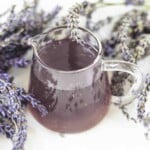 Overhead view of lavender syrup with flowers.