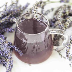 Overhead view of lavender syrup with flowers.