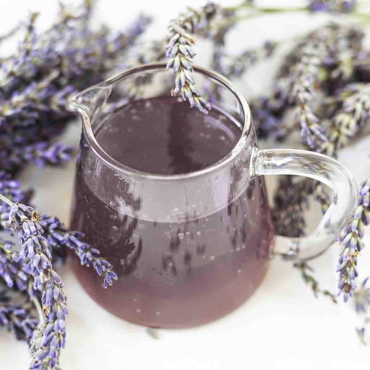 Overhead view of lavender syrup with flowers.
