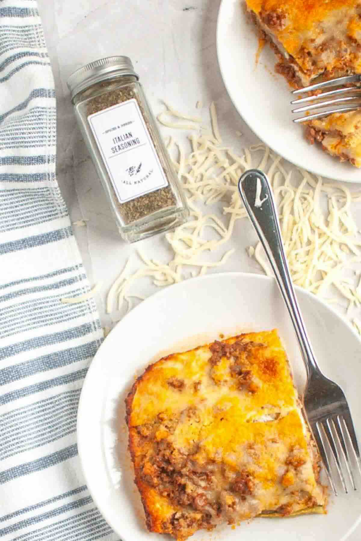 Overhead view of zucchini lasagna with seasoning jar.