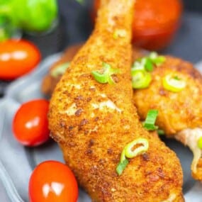 Close up of crispy chicken legs reheated.