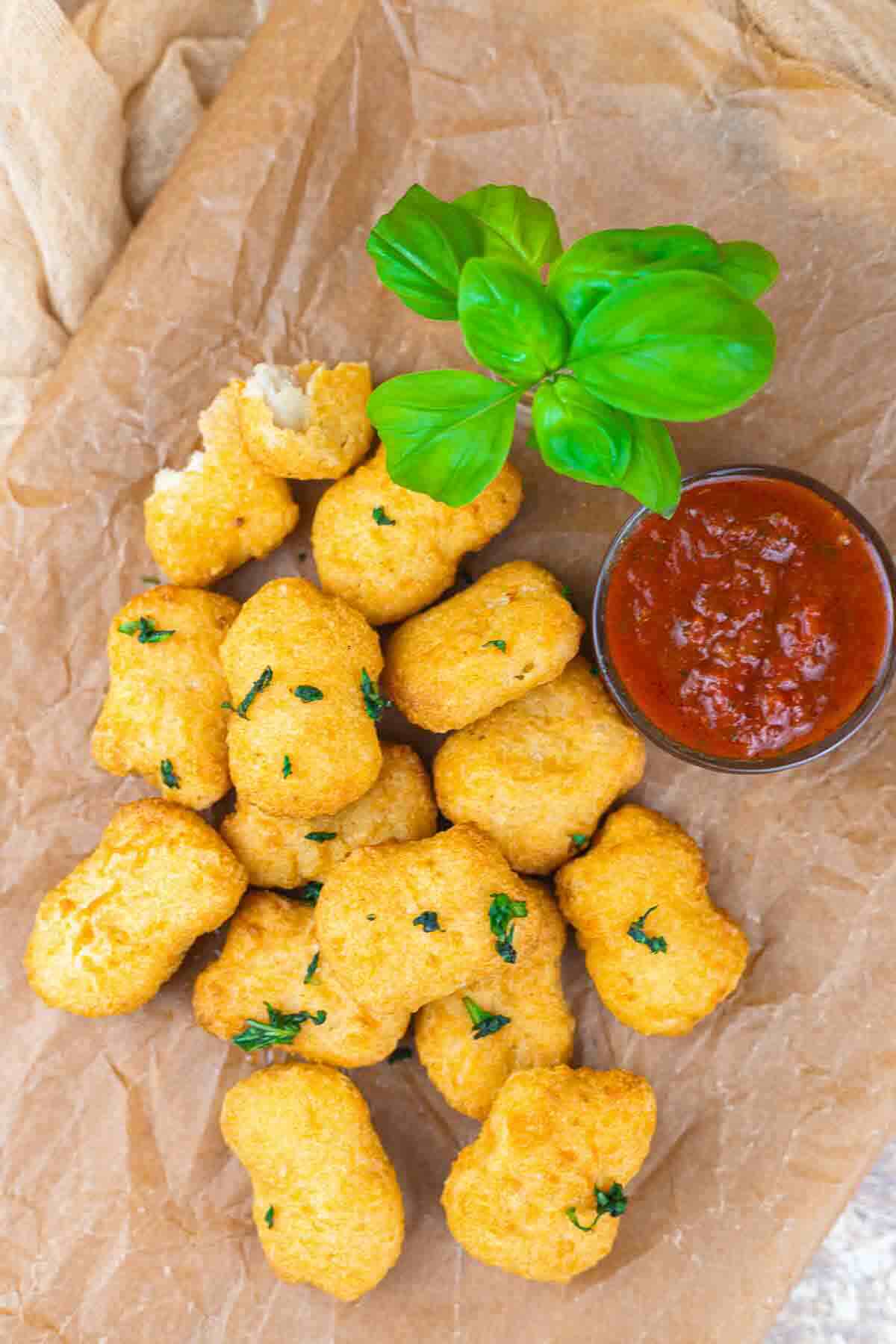 Air fried chicken nuggets with fresh garnish.