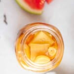 Overhead jar view of pickled watermelon rind.