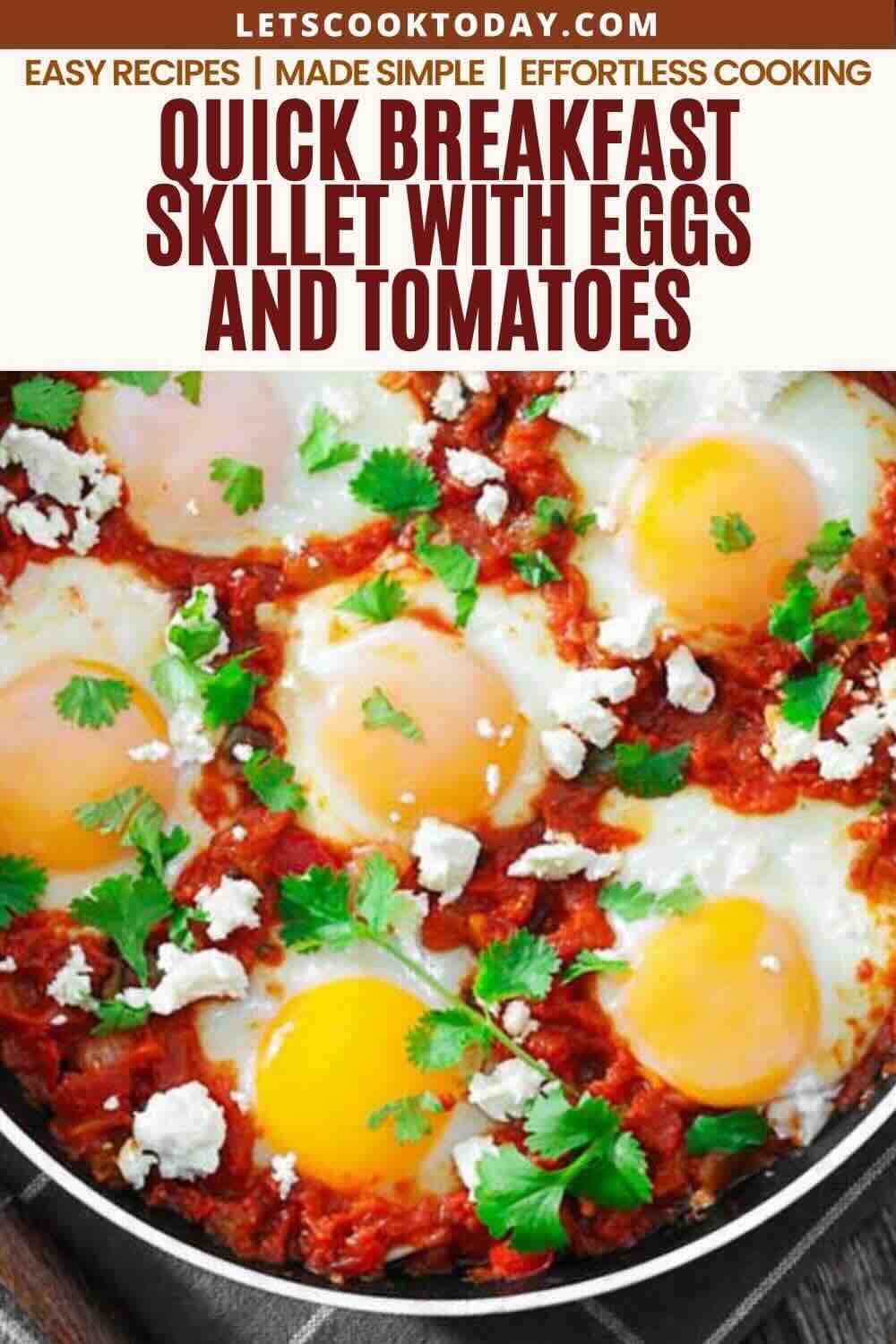 Skillet with cooked eggs, tomatoes, herbs, and cheese, viewed from above. Text at top reads, “Quick Breakfast Skillet with Eggs and Tomatoes.”.