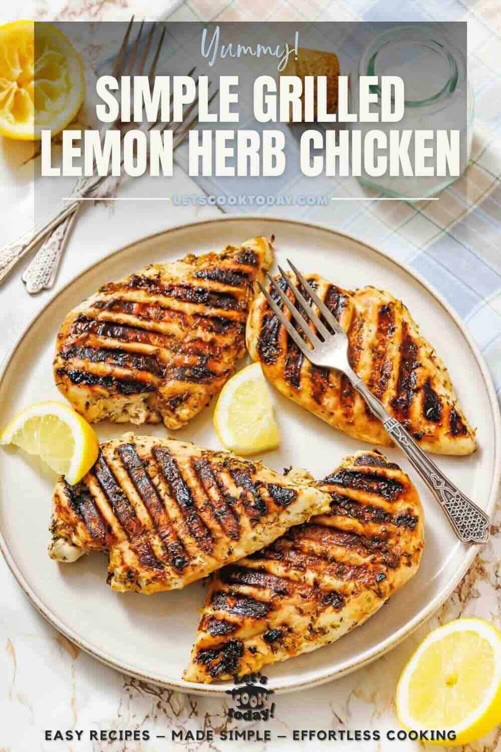 Three grilled chicken breasts with grill marks served on a plate with lemon wedges and a fork.